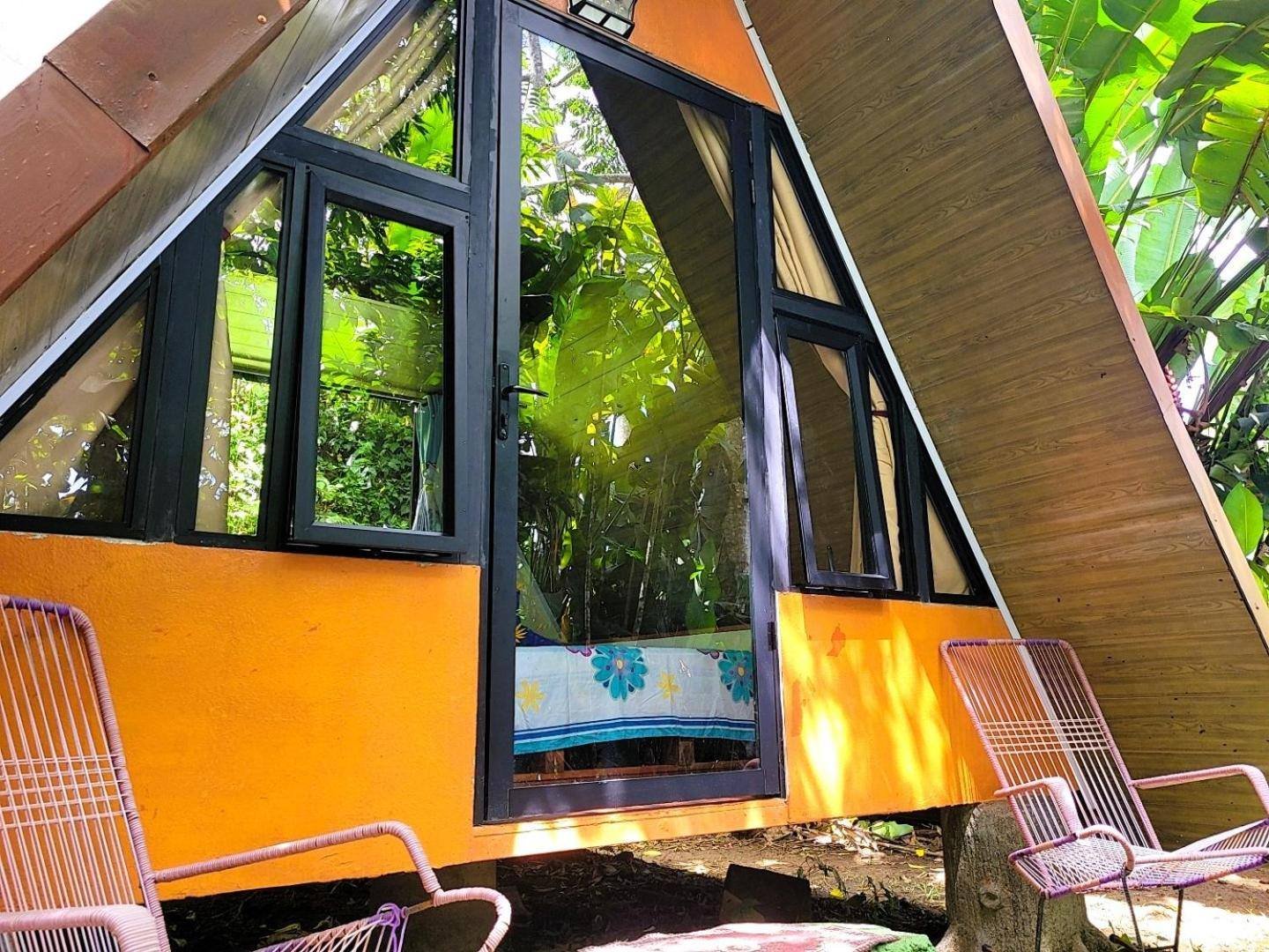 Chalet with large windows facing the forest